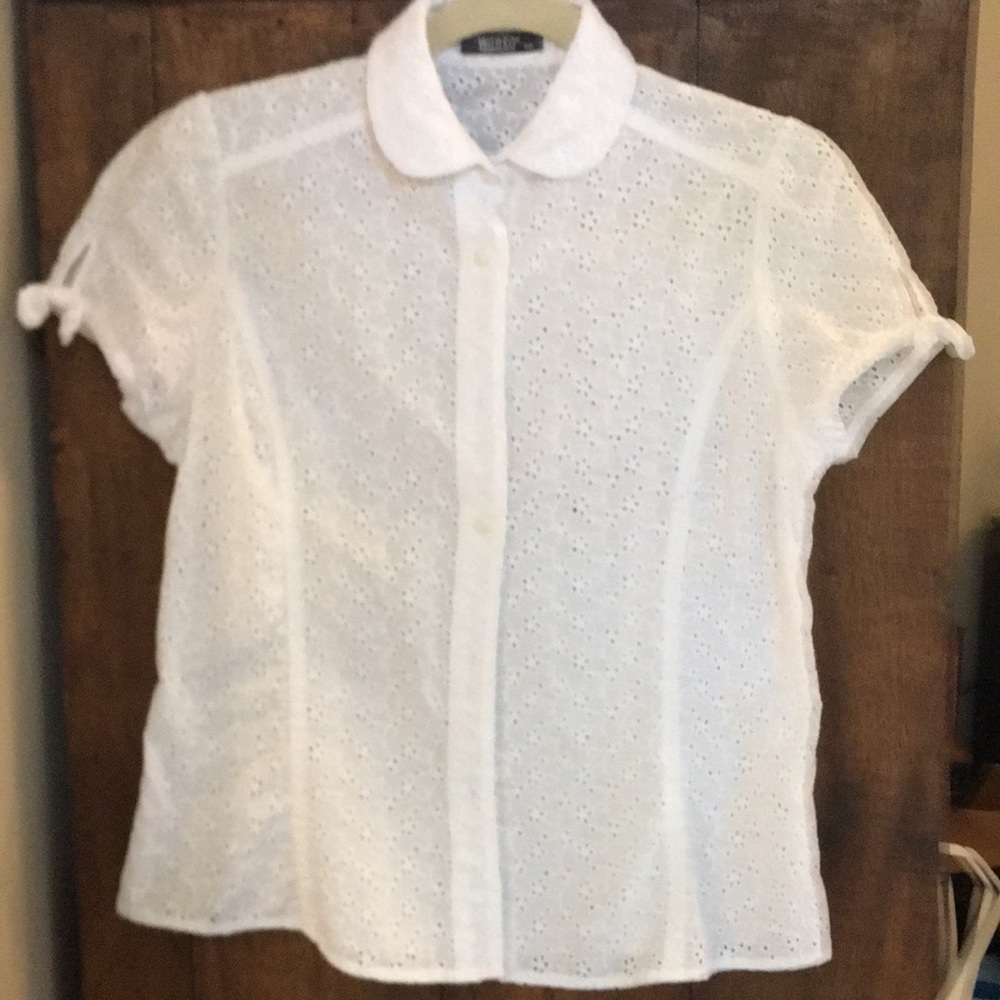 White eyelet short sleeved blouse.